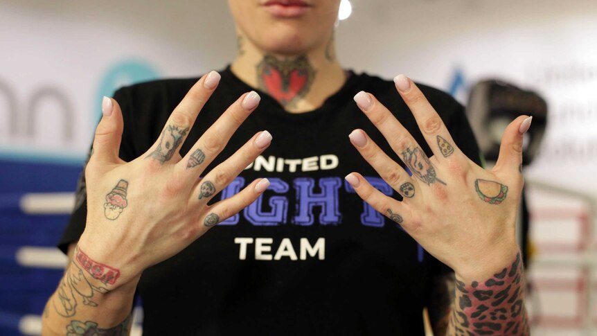 Bec Rawlings shows her hands during training for her second professional fight