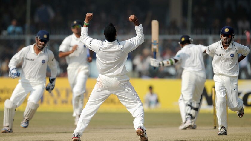Milestone rout: Harbhajan Singh celebrates the wicket of Prasanna Jayawardene.