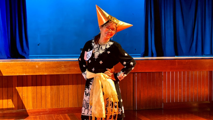 A woman wearing traditional costume from West Sumatra during a fashion show