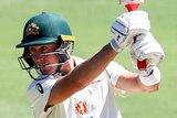 Australia batsman Marnus Labuschagne goes down on one knee as he completes a shot against India bowler T Natarajan.