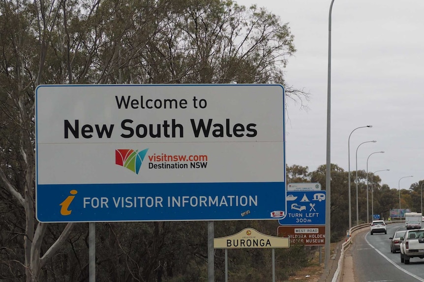 A welcome to New South Wales sign across the George Chaffey Bridge from Wodonga.