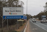 A welcome to New South Wales sign across the George Chaffey Bridge from Wodonga.