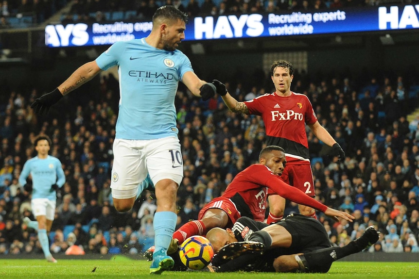 Watford goalkeeper Heurelho Gomes collides with teammate Molla Wague against Manchester City in the Premier League.