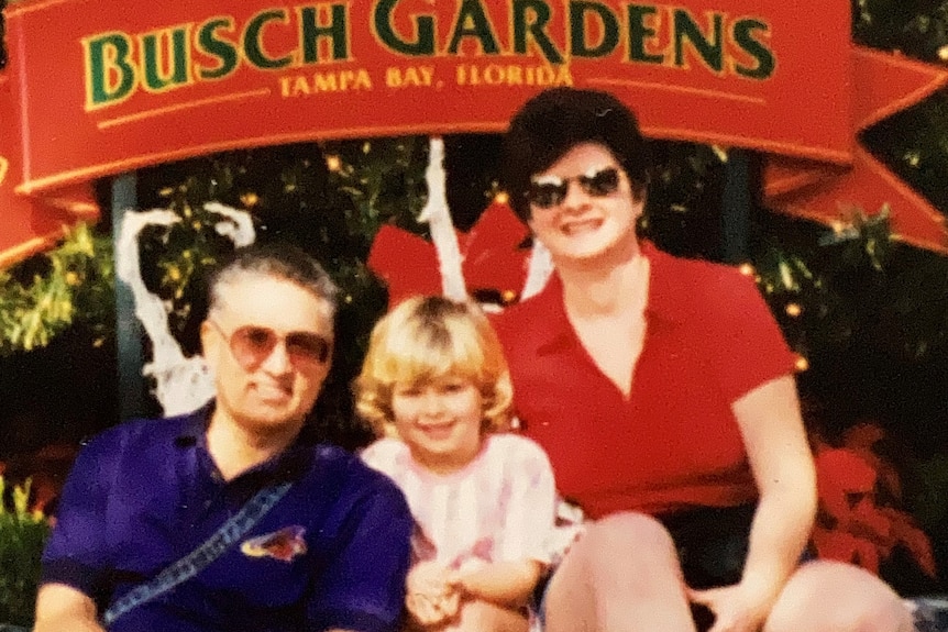 An old family photo showing Jessica with her parents in the mid-1990s.