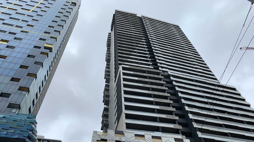 Looking up at the Neo200 apartment building in Melbourne's CBD from the ground.
