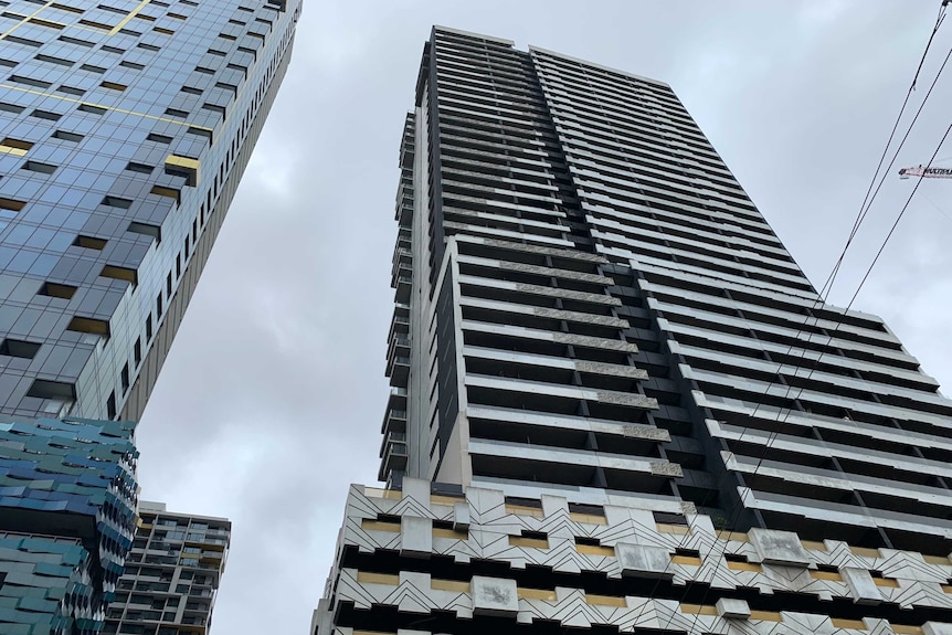 Looking up at the Neo200 apartment building in Melbourne's CBD from the ground.