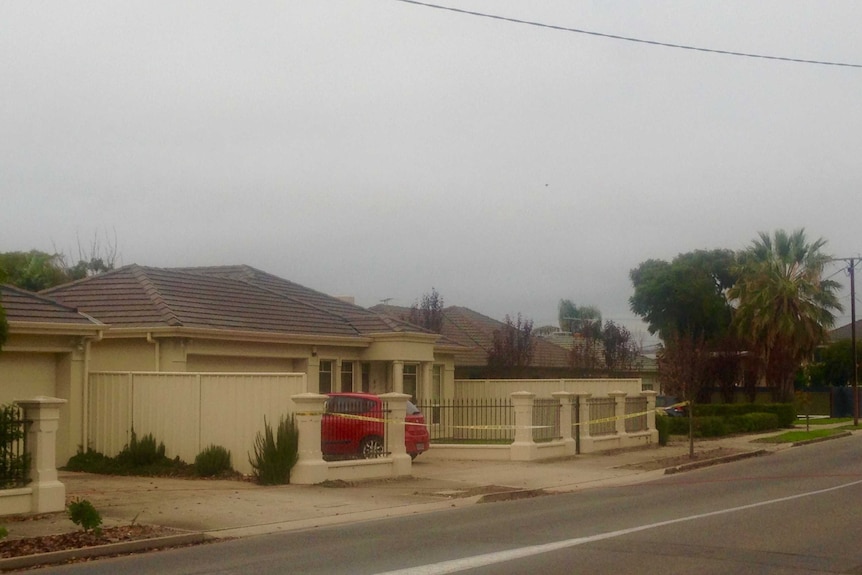 An Adelaide suburban home with police tape across the front