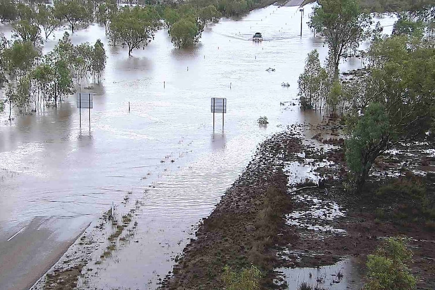 Car crosses floodways in the Kimberley
