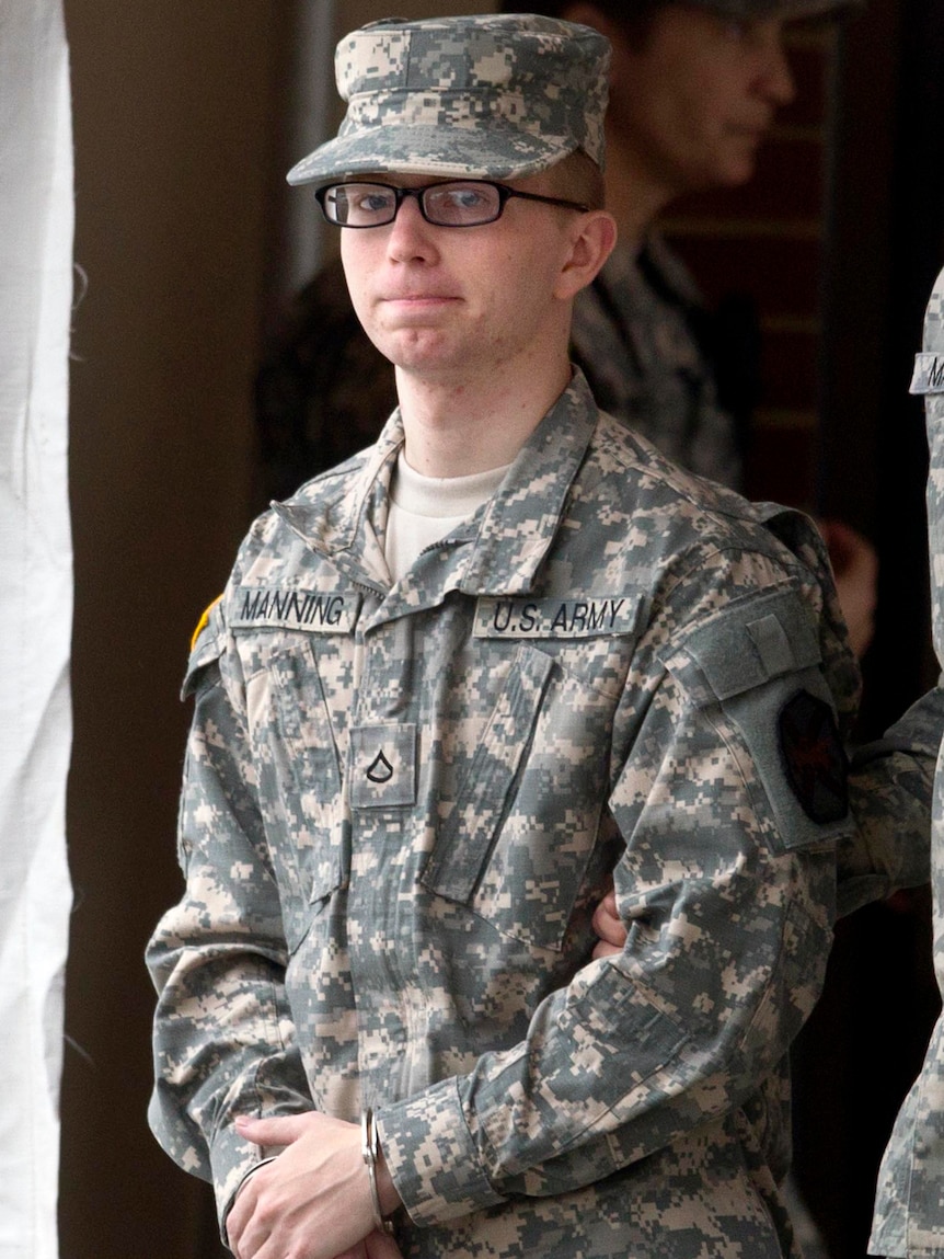 Army Pfc Bradley Manning is escorted by military police from the courthouse at Fort Meade.