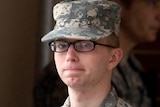 Army Pfc Bradley Manning is escorted by military police from the courthouse at Fort Meade.