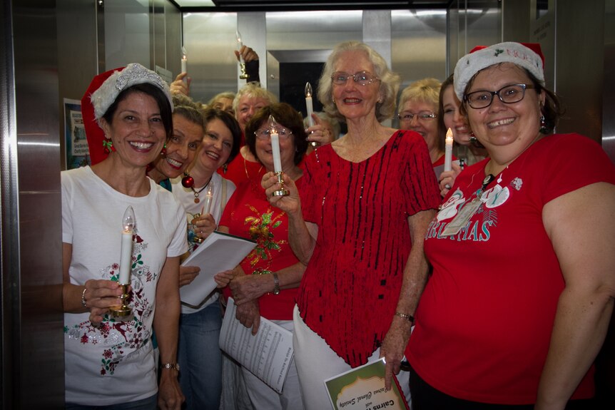Carollers in lift at cairns Hospital.