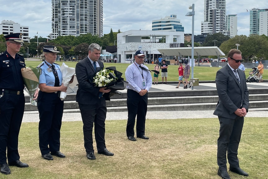 Acting Premier Steven Miles at makeshift helicopter crash memorial