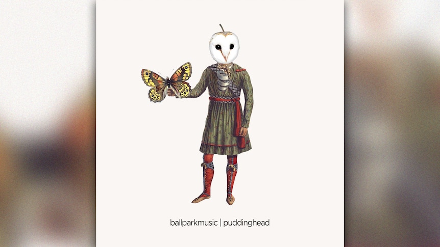 Album cover of Ball Park Music's 'Puddinghead'. A man wearing medieval garb with an owl head and holding a giant moth. 