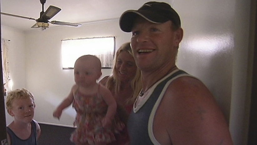 Brett Rodgers, Kylie Lewis and their kids checking out their new rental house at Beachmere.