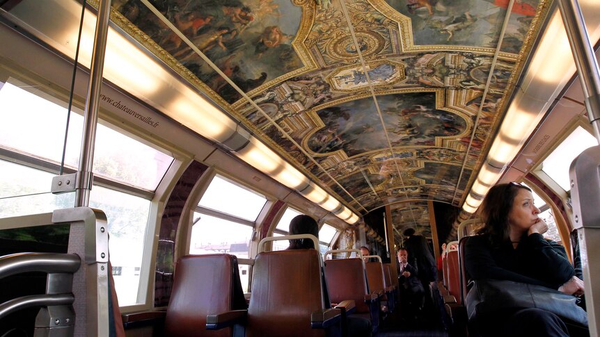 Chateau de Versailles' decorations on the ceiling of a Regional Express Network train in Paris.