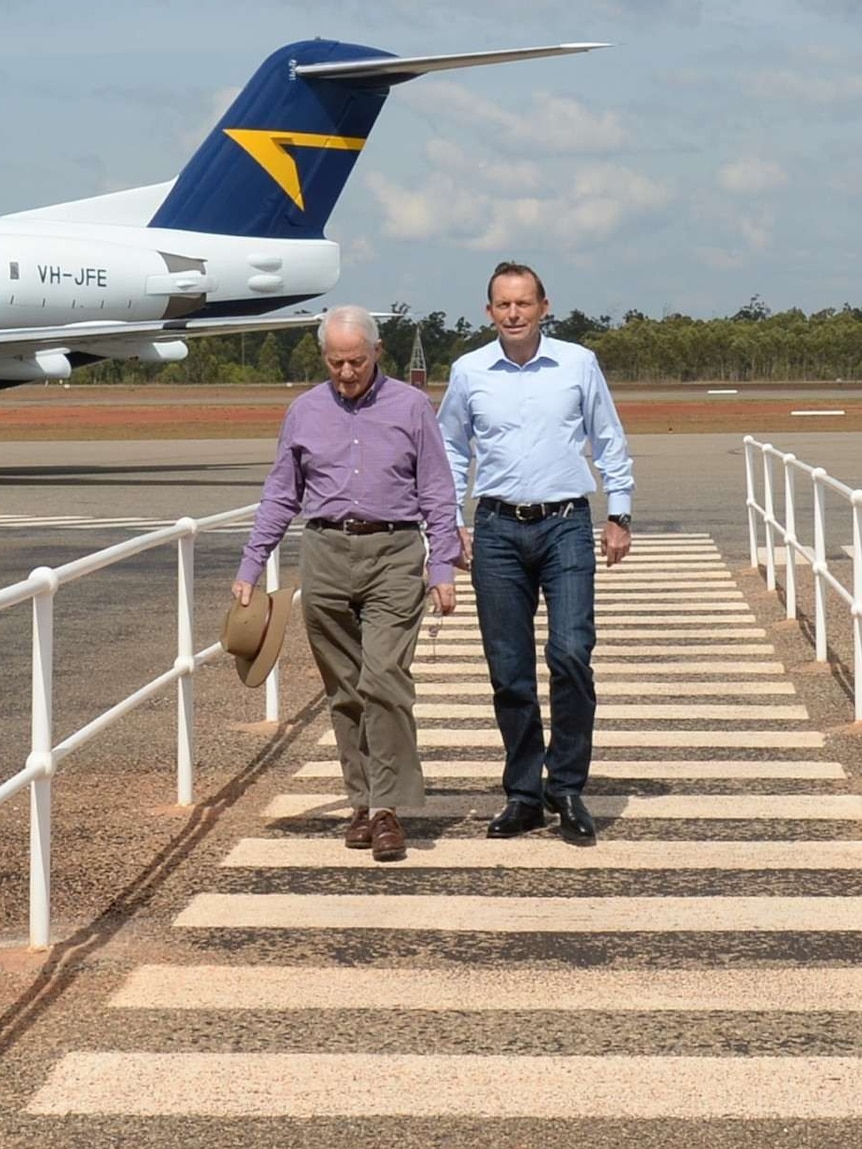 Tony Abbott and Philip Ruddock arrive at Gove airport
