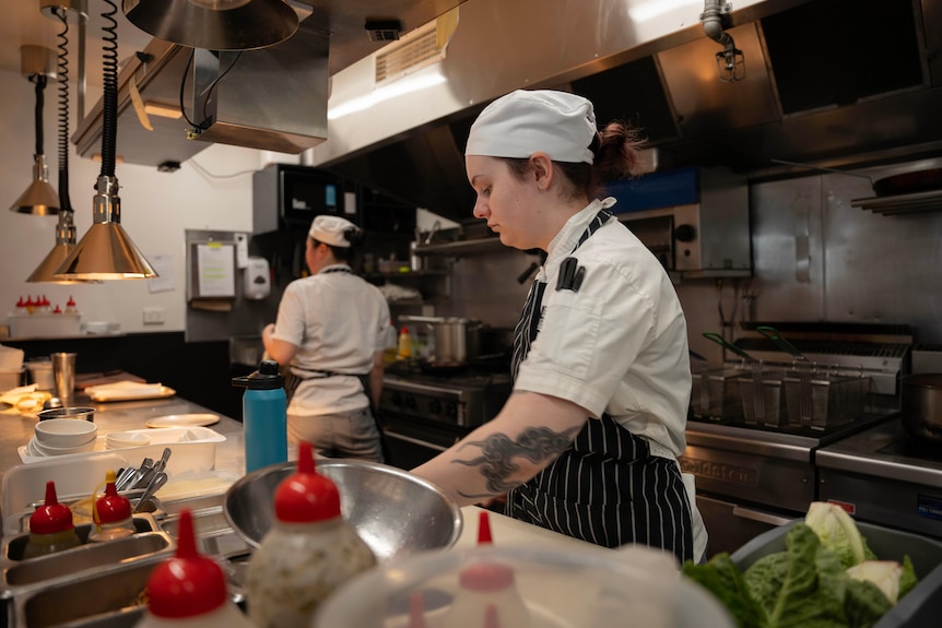 Two women work in a restaurant kitchen