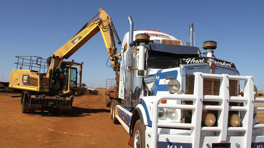 Steel being loaded onto a truck