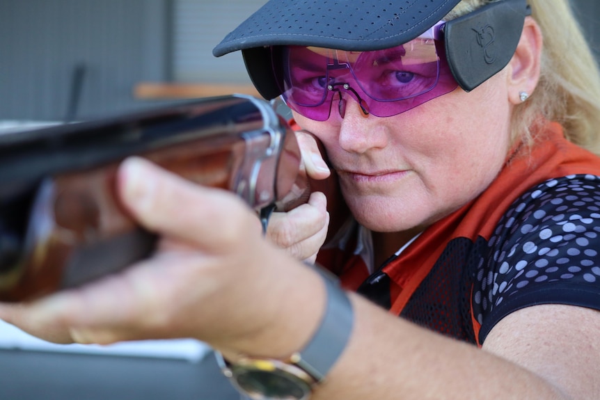 A close up shot of Tania Harris aiming her gun.