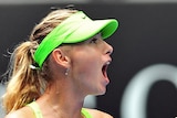 Maria Sharapova celebrates winning a point against Angelique Kerber