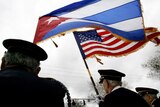Cuban American vetrans hold Cuban and US flags