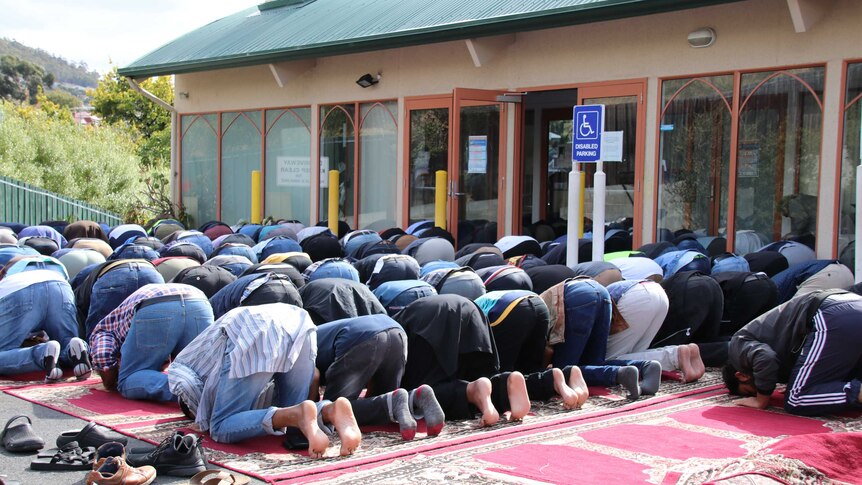 People praying at Hobart's only mosque.