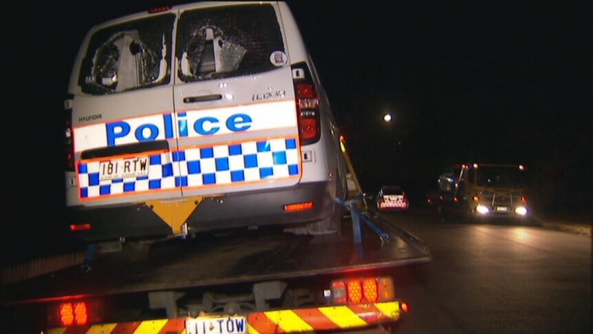 Smashed police car towed from Brisbane party