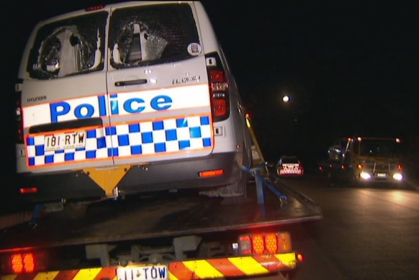 Smashed police car towed from Brisbane party