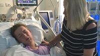 Lachlan Miles in ICU with his mother Rhonda by his side.