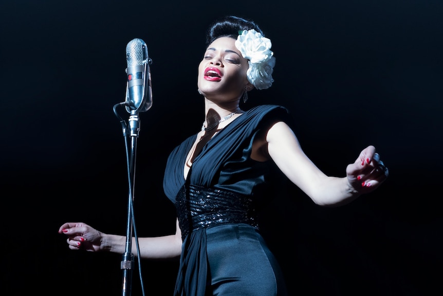 Film still of Andra Day as Billie Holliday singing on stage from The United States vs Billie Holiday
