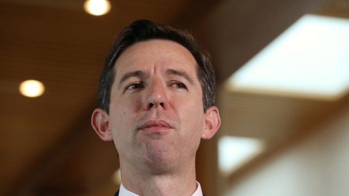 Simon Birmingham at a press conference