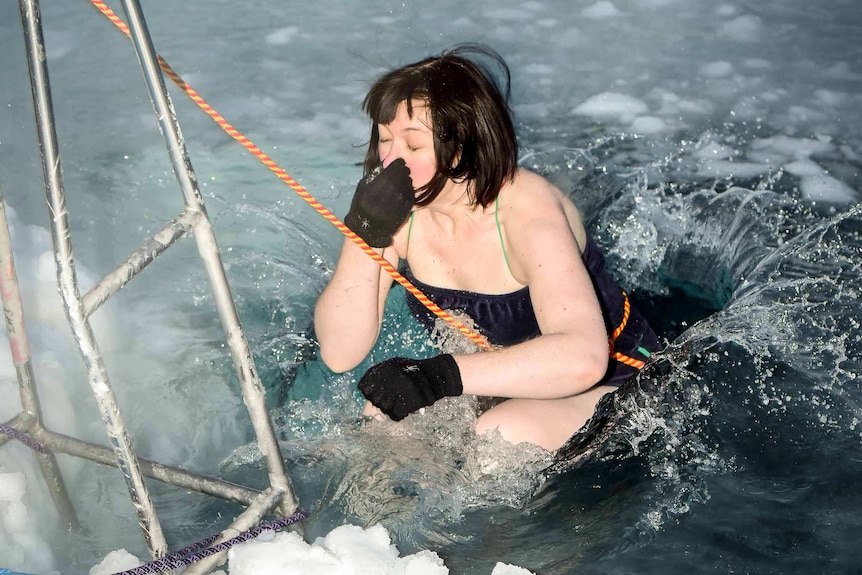 Dr Cathryn O'Sullivan jumping in icy water.