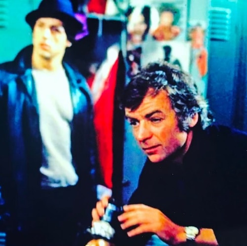 Director John Avildsen on the set of one of the Rocky films. Sylvester Stallone is just visible in the background.