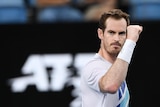 Australian tennis player Andy Murray raises fist in the air after beating Great Britain's Reilly Opelka at Sydney Tennis Classic