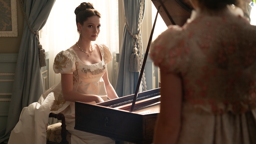 The character of Francesca Bridgerton seated at the piano. 
