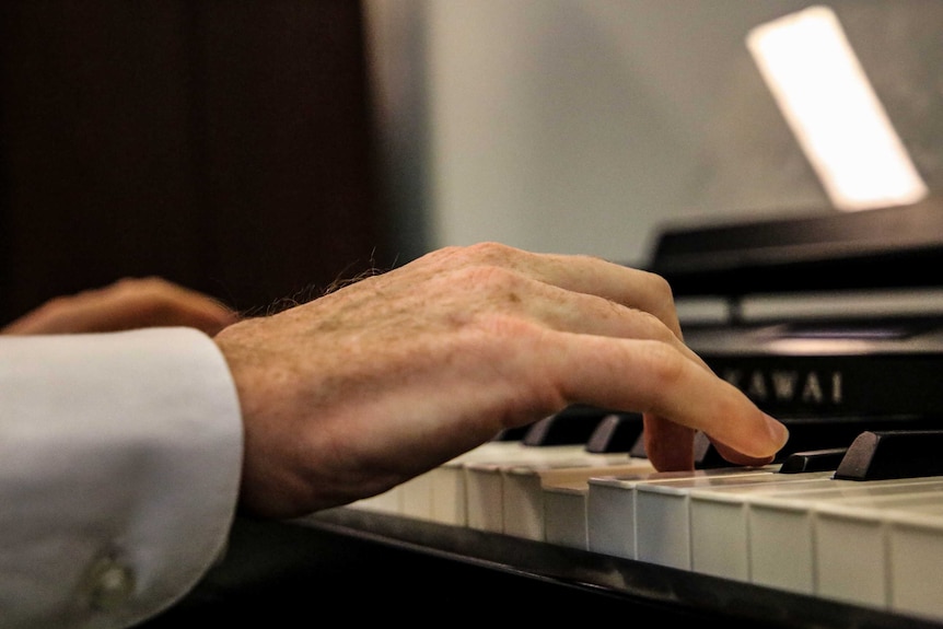 Tony Burke plays the keyboard in his office at Parliament House.