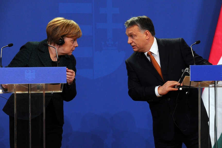German Chancellor Angela Merkel chats with Hungarian prime minister Viktor Orban