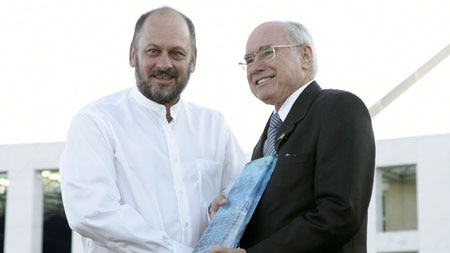 Former prime minister John Howard presents the Australian of the Year award to Professor Tim Flannery in January.