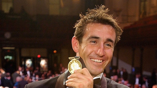 Success, as well as failure, can be terrifying ... Andrew Johns poses with the Dally M Medal in 2002.