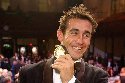 Success, as well as failure, can be terrifying ... Andrew Johns poses with the Dally M Medal in 2002.