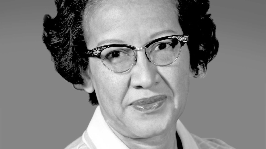 A black and white portrait of Katherine Johnson when she was younger. She is wearing glasses.
