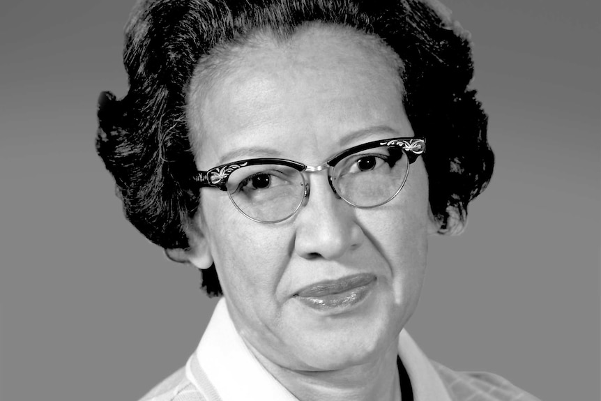 A black and white portrait of Katherine Johnson when she was younger. She is wearing glasses.