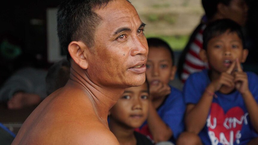 Construction worker Mayan Masta came to Bali's evacuation camp with his wife and two boys.