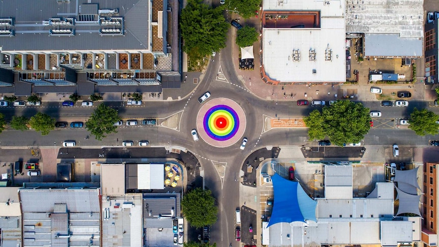 An aerial view of a rainbow roundabout