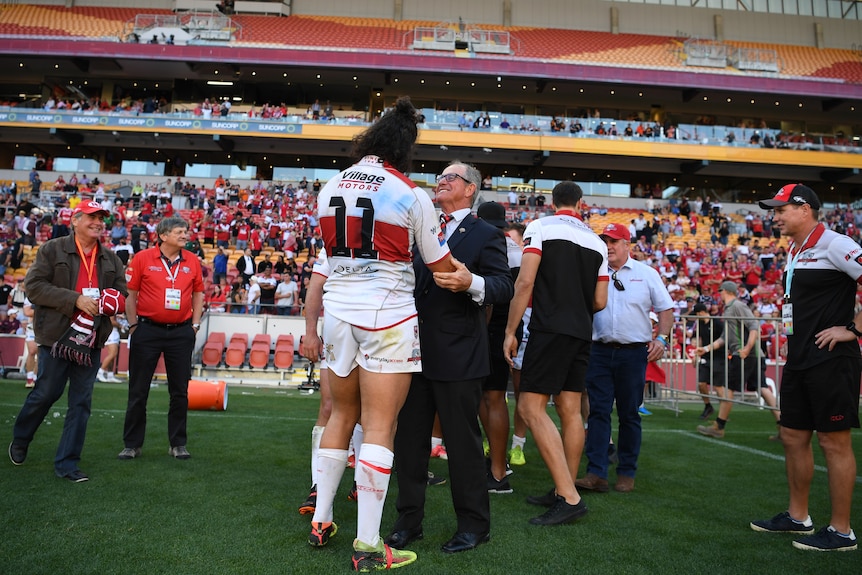 Current Chairman bob Jones congratulates Toby Rudolph after the 36-22 Grand Final win.