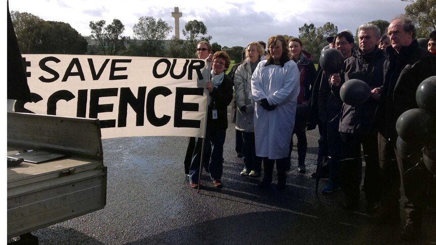 Scientists at the Australian Animal Health Laboratory (AAHL) in Geelong protest federal budget cuts to CSIRO.