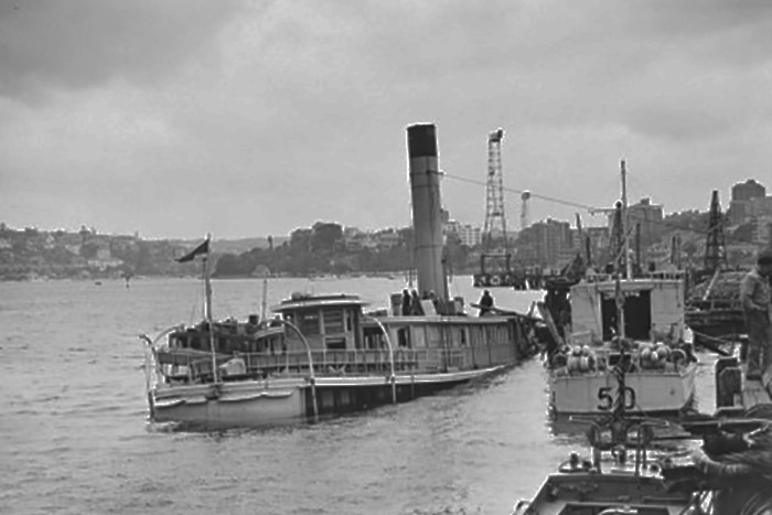 HMAS Kuttabul partially submerged after a Japanese midget submarine attack in Sydney Harbour.