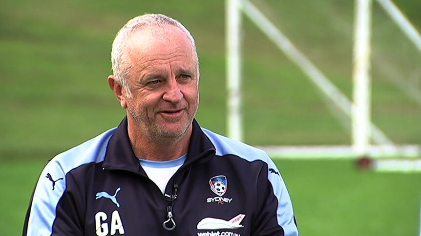Sydney FC coach Graham Arnold speaks to camera.