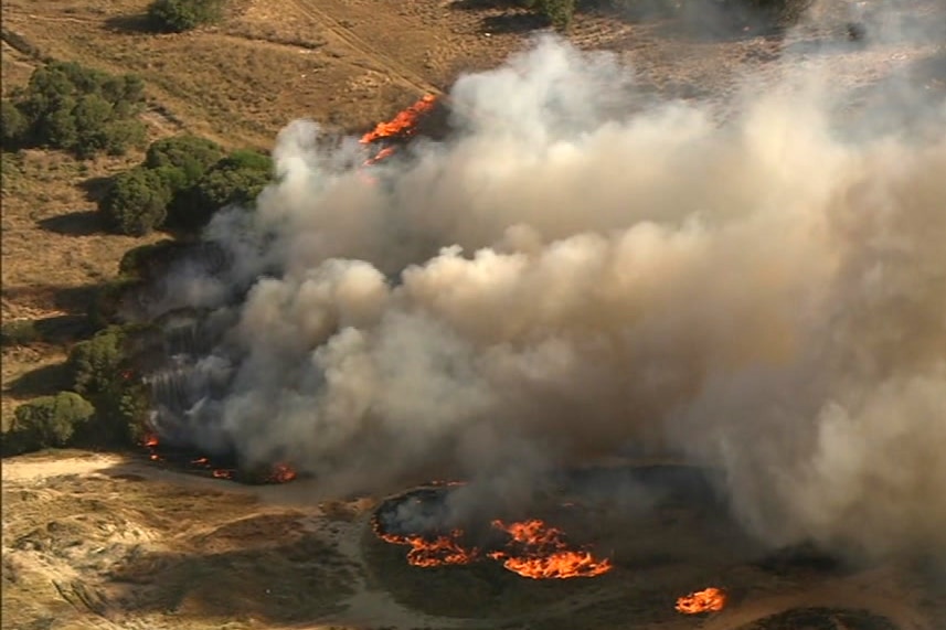 An aerial shot of flames from a bushfire.