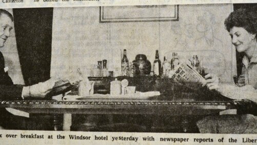 Malcolm Fraser and Tamie Fraser reading newspapers at breakfast.